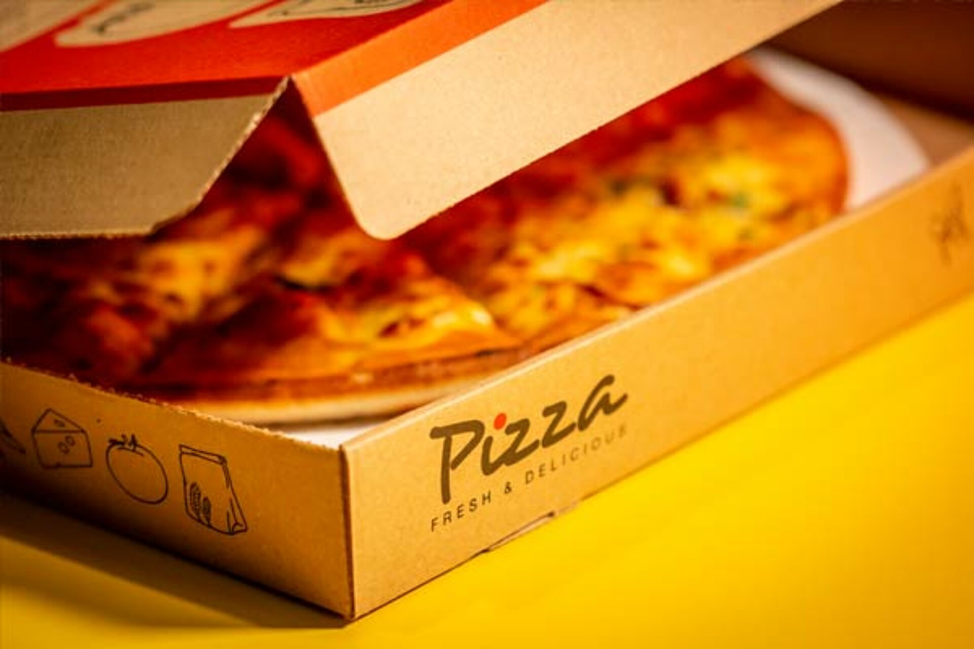 Dino Diner pizza in its box on a table at West Midlands Safari Park, ready to be served as part of a fun, themed meal