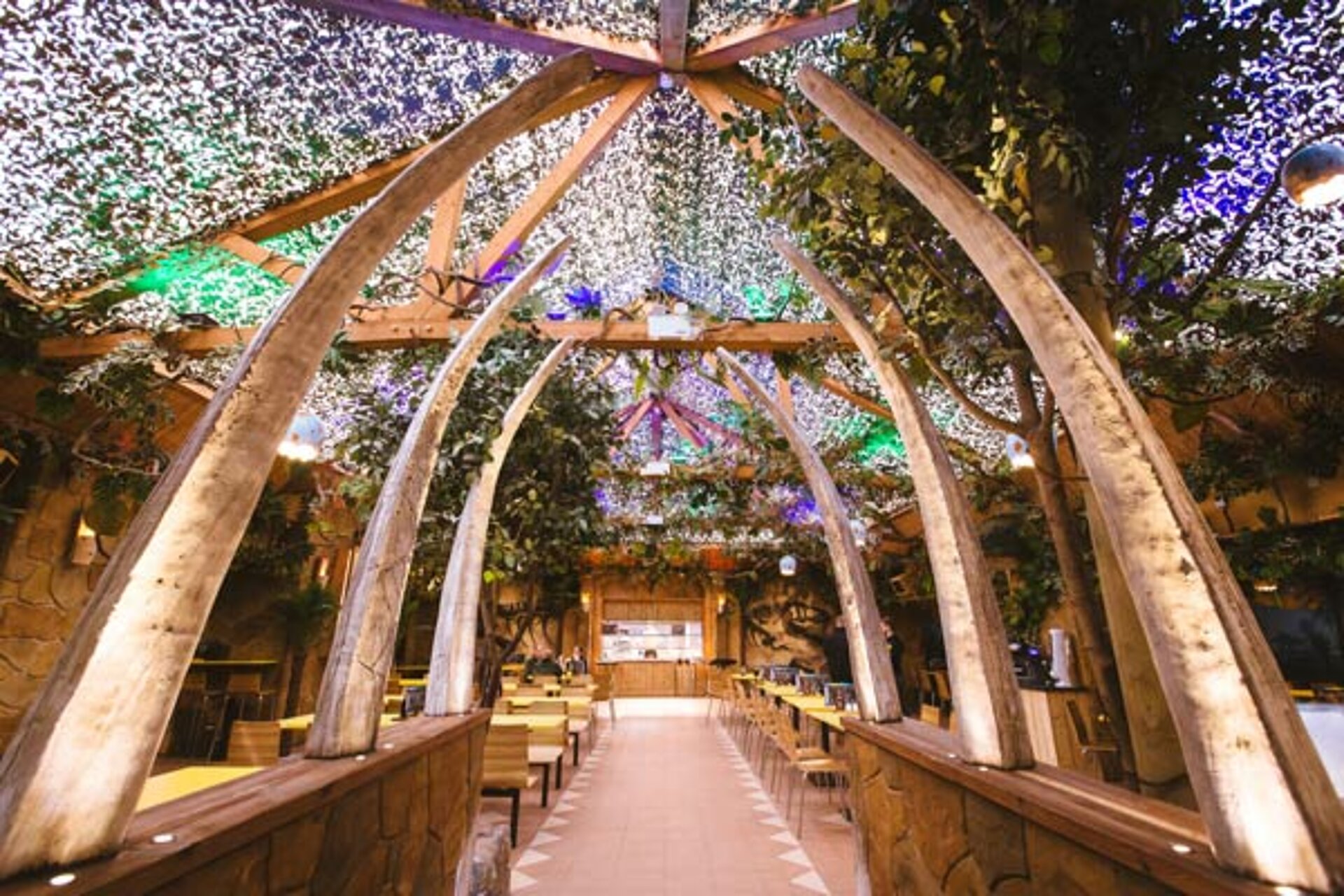 Interior of the Dino Diner at West Midlands Safari Park, showing dinosaur-themed decorations, tables, and a bright, family-friendly dining area